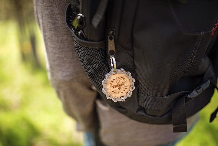 Converts to a keychain after the ride - sustainable and recycled